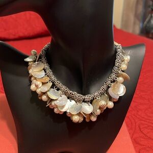 Unique shell and bead necklace with silver chain and clasp.  Like new!